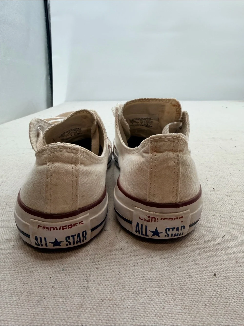 Converse Low Top Sneakers in Cream with Red Trim
